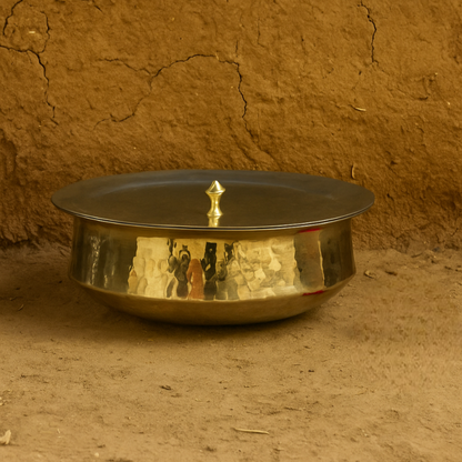 Authentic brass lagan vessel with rich golden tone, often used for slow-cooked dishes during weddings and religious feasts